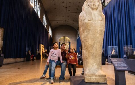 A family views an exhibit at the current Egypt Gallery of the Penn Museum. It will close on November 6 to allow creation of the new Ancient Egypt and Nubia galleries.