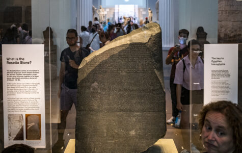 This picture taken on July 23, 2022 shows a view of the Rosetta Stone at the British Museum in London. (Photo by Amir MAKAR / AFP) / RESTRICTED TO EDITORIAL USE - NO MARKETING NO ADVERTISING CAMPAIGNS